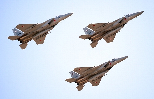 

F-15 jets fly during the military review at the Japan’s Asaka training ground. Photo credit: TORU YAMANAKA/AFP/GettyImages