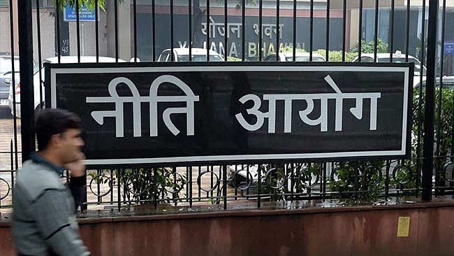 A man walks past the NITI Aayog headquarters.