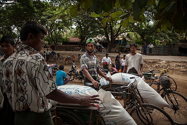 Rohingya men at the Thet Kay Pyin market in Sittwe, Myanmar. Photo credit: Lauren DeCicca/GettyImages