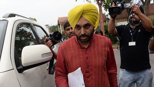 Aam Aadmi Party (AAP) Member of Parliament Bhagwant Mann arrives at the Indian parliament to appear before an inquiry committee in New Delhi. Photo credit: PRAKASH SINGH/AFP/Getty Images