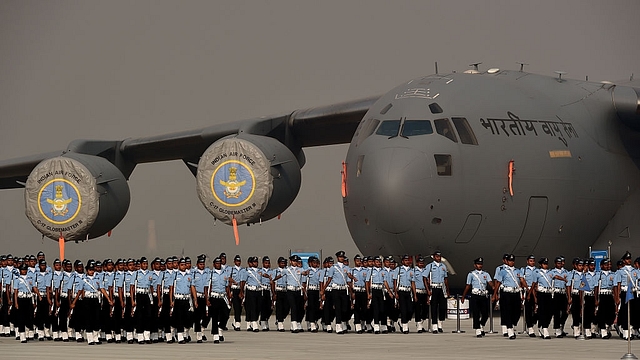 Indian Air Force
personnel march past a C-17 Globemaster during the Air Force Day parade on the
outskirts of New Delhi. Photo credit: MONEY SHARMA/AFP/GettyImages&nbsp;