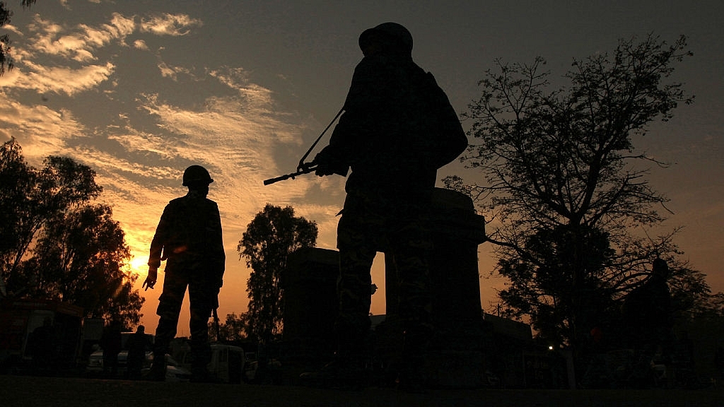 Indian army soldiers patrol on the Jammu-Srinagar National Highway during a combing operation at Nagrota,  Jammu. Photo credit: STRINGER/AFP/Getty Images