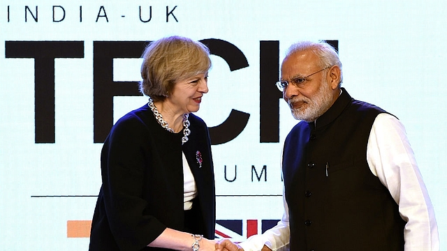 Britain’s Prime Minister Theresa May (L) with India’s Prime Minister Narendra Modi at The India-UK Tech Summit in New Delhi (PRAKASH SINGH/AFP/Getty Images)