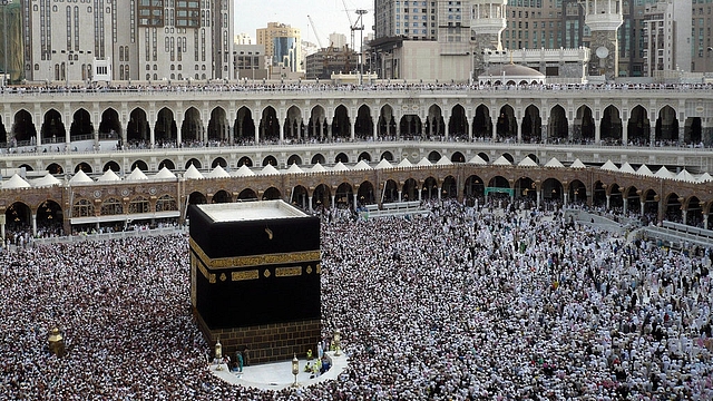 
Muslim pilgrims crouch to perform their fairwell circumambulation 
around Kaba. Photo credit: ROSLAN RAHMAN/AFP/GettyImages

