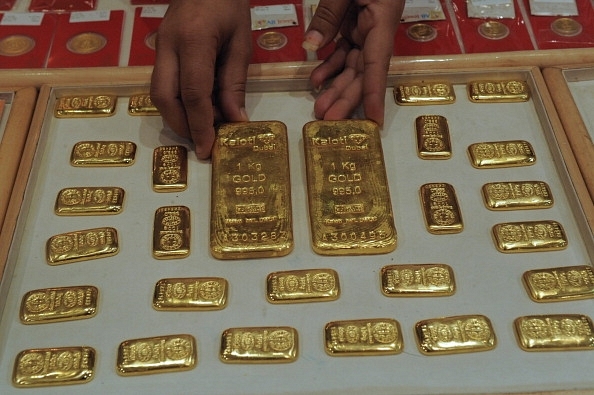 

An Indian saleswoman arranges gold bars at a jewellery store in Ahmedabad.&nbsp;