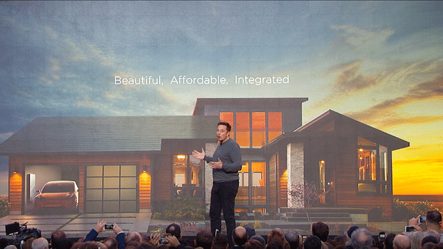 Elon Musk unveiling his latest offering, solar rooftop tiles (Photo Credit: SolarCity)