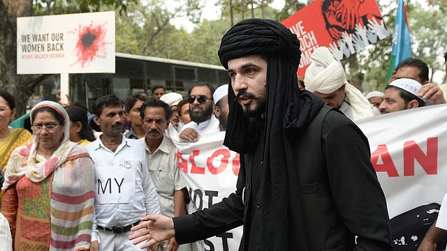 Mazdak Dilshad Baloch (C), son of prominent author-activist Naela Qadri Baloch and filmmaker Mir Ghulam Mustafa Raisaini, takes part in a protest against Pakistan’s ongoing human right violation in Balochistan. (PRAKASH SINGH/AFP/Getty Images)