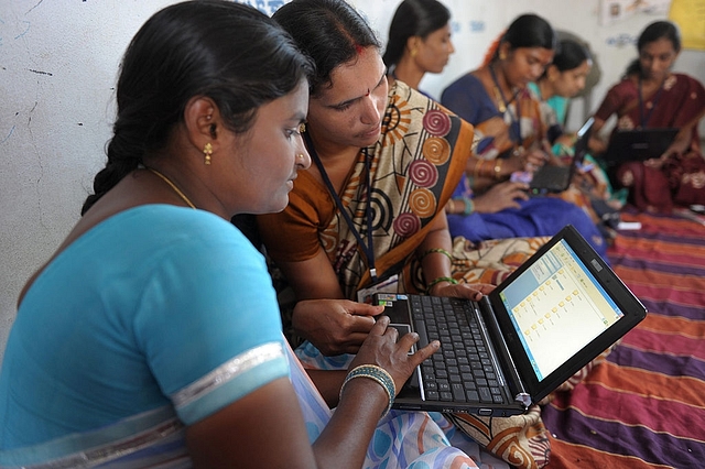 Villagers from Bibinagar using computers in the outskirts of Hyderabad. Photo credit: NOAH 
SEELAM/AFP/GettyImages

