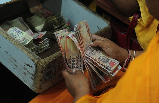 Rs 1000 and Rs 500 notes (SANJAY KANOJIA/AFP/Getty Images)