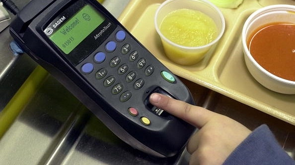 

A student places a finger on the fingerprint scanner to pay for lunch at Penn Cambria Pre-Primary School in Altoona, Pennsylvania. Photo credit: William Thomas Cain/GettyImages