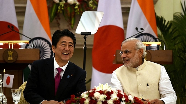 Prime Minister Narendra Modi with Japan’s Prime Minister Shinzo Abe. (MONEY SHARMA/AFP/GettyImages)