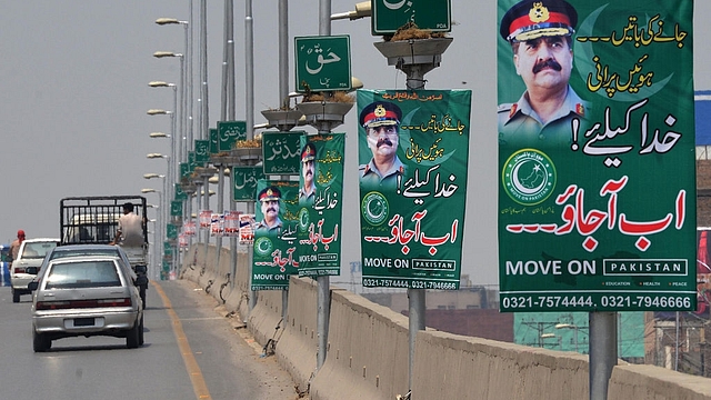 Posters of army chief General Raheel Sharif, urging him  to launch a coup (A MAJEED/AFP/Getty Images)