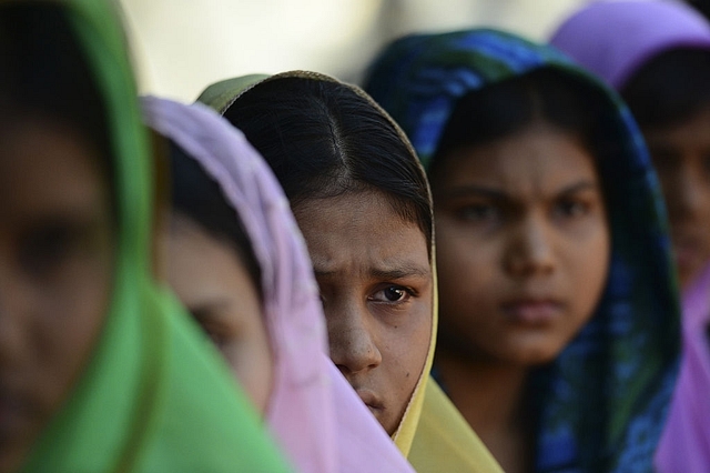 Residents of the Muslim village of Gozirbill near the Rakhine town of Maungdow, after their escape from Myanmar, at a refugee camp in Teknaf of southern Cox’s Bazar district. (MUNIR UZ ZAMAN/AFP/Getty Images)