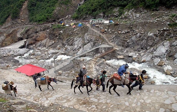 Devotees travelling to Kedarnath Temple. Photo credit: SHAMMI MEHRA/AFP/GettyImages