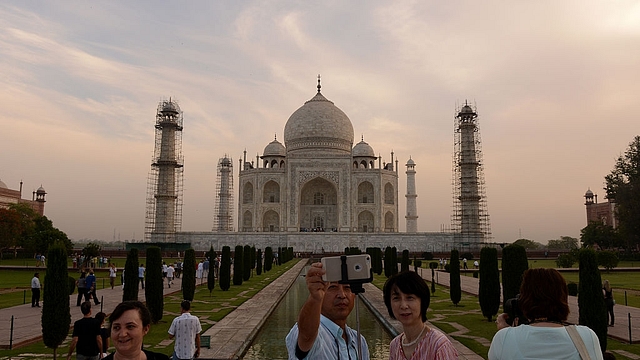 
Tourists take a Selfie as they visit the Taj Mahal in Agra. (MONEY SHARMA/AFP/Getty Images)

