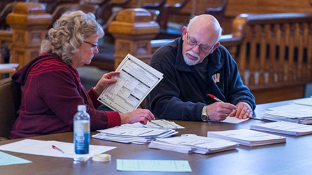 Tabulators count ballots on the presidential recount at the Green County Courthouse in Monroe, Wisconsin. (Andy Manis/Getty Images)