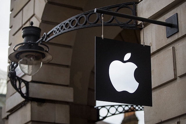 The Apple logo sits on a sign outside company’s Covent Garden store  in London, England. Photo credit: Jack Taylor/Getty Images