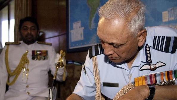 Tyagi signs the guest’s book at the Sri Lankan navy
headquarters in Colombo. (SANKA VIDANAGAMA/AFP/GettyImages)