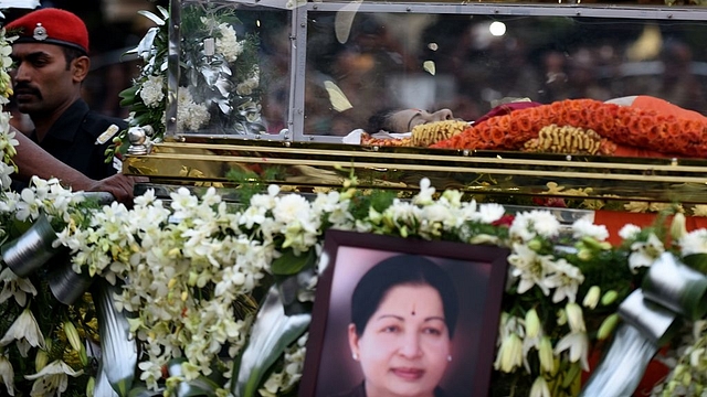 

The mortal remains of Jayalalithaa are carried during a procession to her burial place in Chennai. Photo credit: ARUN SANKAR/AFP/GettyImages