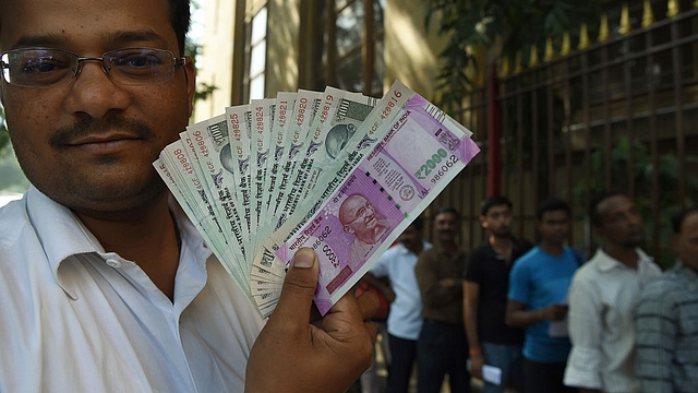 Demonetisation. Photo credits: PUNIT PARANJPE/AFP/Getty Images