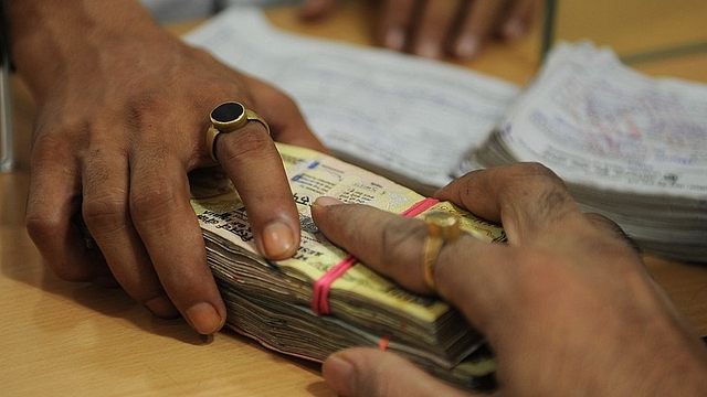 Banking transaction (INDRANIL MUKHERJEE/AFP/Getty Images)