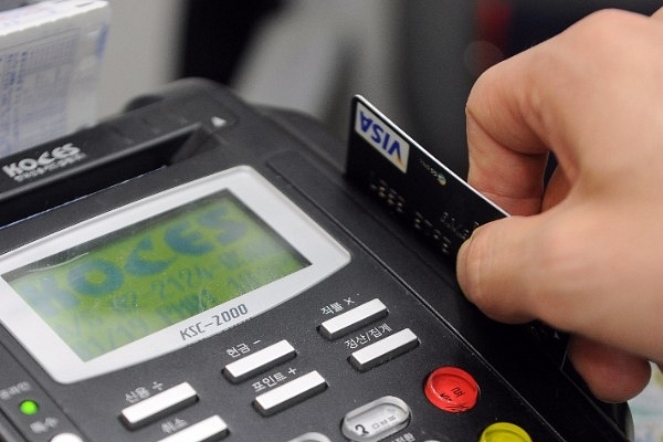 Credit card register. Photo credit: PARK JI-HWAN/AFP/Getty Images