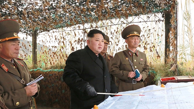 North Korean leader Kim Jong-Un (C) at the defence detachment on Mahap Islet in Ongjin County, South Hwanghae. Photo credit: KNS/AFP/Getty Images