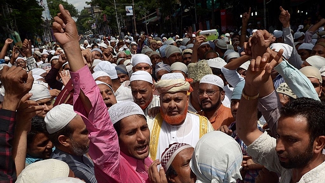 Muslims shout slogans against the central government after offering special prayers the day after the execution of convicted bomb plotter Yakub Memon in Kolkata (DIBYANGSHU SARKAR/AFP/GettyImages)