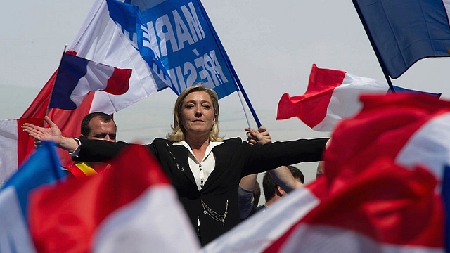 Marine Le Pen gestures as she delivers a speech during the French Far Right Party May Day demonstration in Paris, France. (Pascal Le Segretain/Getty Images)