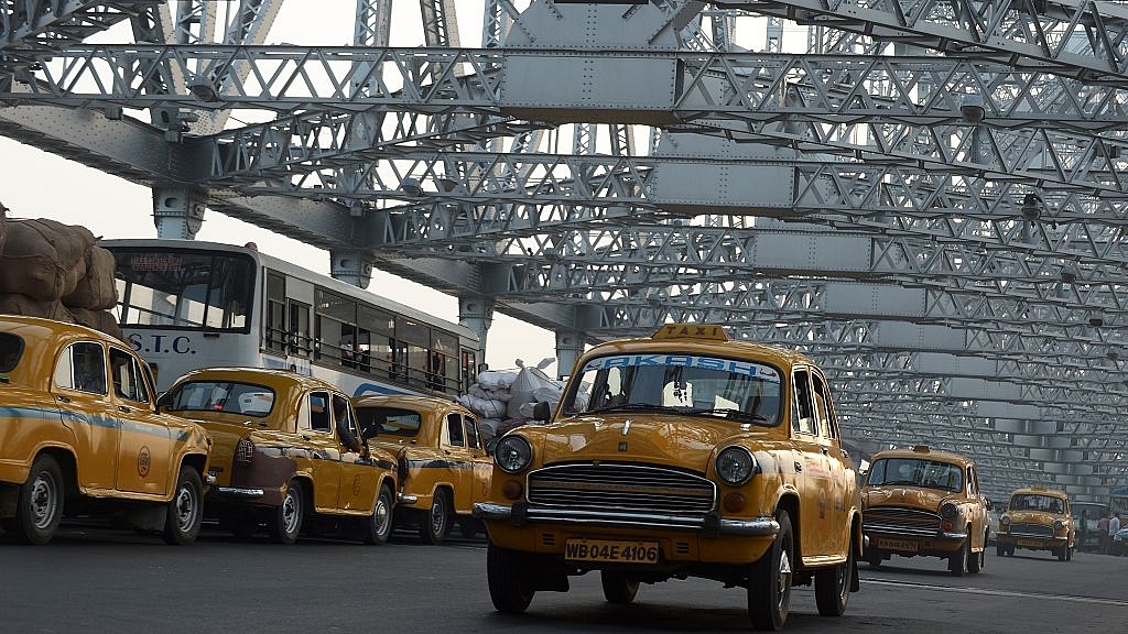 Indian commuters and taxi drivers navigate through heavy traffic on Howrah Bridge in Kolkata. (DIBYANGSHU SARKAR/AFP/Getty Images)