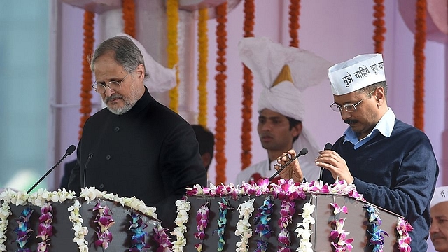 Kejriwal and Jung during the former’s swearing-in ceremony in New Delhi. (PRAKASH SINGH/AFP/GettyImages)