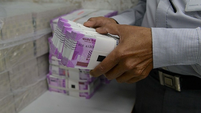 Stacks of new Rs 2,000 notes (SAM PANTHAKY/AFP/Getty Images)