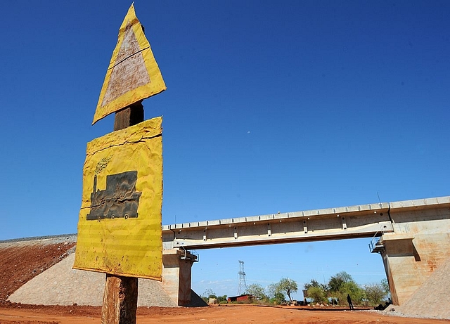 A road sign warning of a railway crossing ahead. Photo credit: TONY KARUMBA/AFP/Getty Images