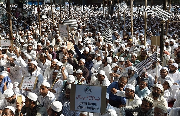 

Indian Muslims take part in a protest rally against the implementation of a Uniform Civil Code in Mumbai on 20 October 2016. Photo credit: PUNIT PARANJPE/AFP/GettyImages