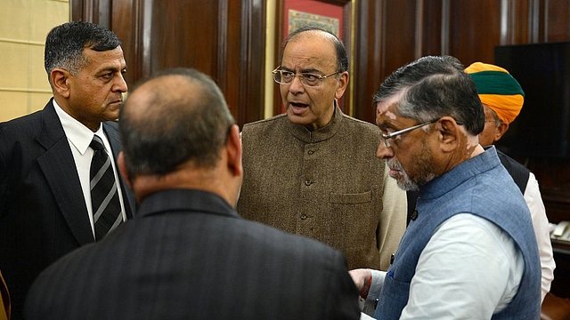 Union Finance Minister Arun Jaitley (C) speaks with members of his team the day before presenting the Union Budget 2017-2018. (SAJJAD HUSSAIN/AFP/Getty Images)