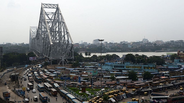 

Public vehicles wait for passengers in the depot near Howrah bridge. (DIBYANGSHU SARKAR/AFP/GettyImages)