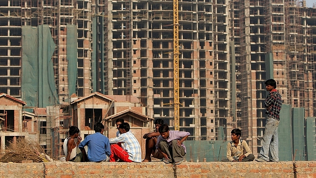  Indian construction workers rest at an under-construction site in Gurgaon, some 30 km south of New Delhi. (MANAN VATSYAYANA/AFP/Getty Images)