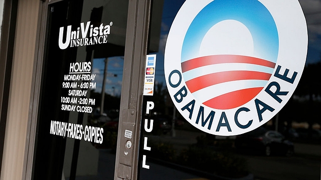 An Obamacare logo on the door of the UniVista Insurance agency in Miami, Florida in 2017 (RHONA WISE/AFP/Getty Images)