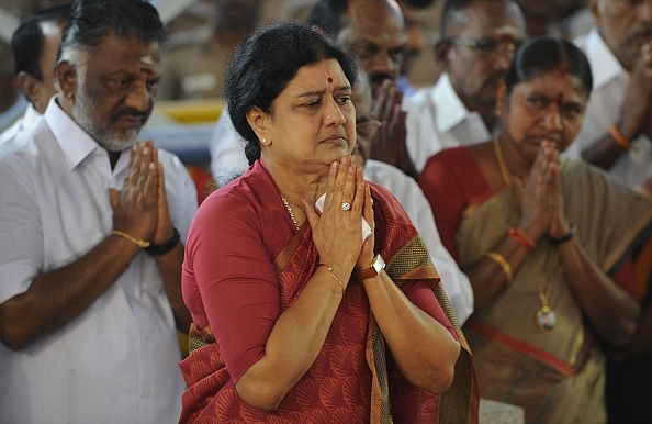 Sasikala and Panneerselvam along with party workers pay their respects at the memorial for Jayalalithaa after Sasikala was elected party general secretary in Chennai. (ARUN SANKAR/AFP/GettyImages)