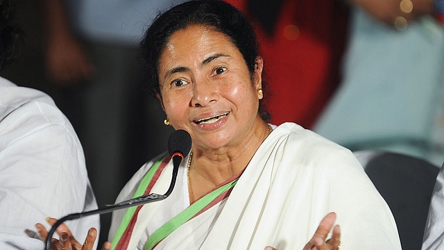 Banerjee gestures as she address a press conference in Kolkata. (DIBYANGSHU SARKAR/AFP/GettyImages)