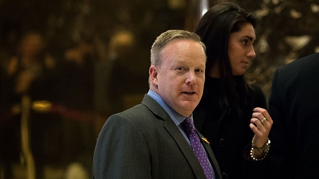 Sean Spicer walks through the lobby at Trump Tower in New
York City. (Drew Angerer/GettyImages)