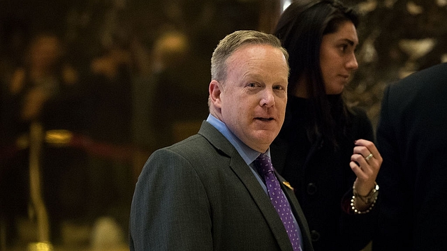 Sean Spicer walks through the lobby at Trump Tower in New
York City. (Drew Angerer/GettyImages)