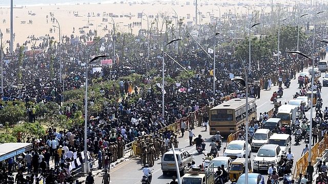 

Protesters gather during a demonstration against the ban on jallikattu and calling for a ban on animal rights orgnisation PETA, at Marina Beach in Chennai. (ARUN SANKAR/AFP/GettyImages)