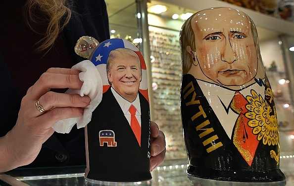 

An employee polishes traditional Russian wooden nesting dolls, Matryoshka, depicting US President Donald Trump (L) and Russian President Vladimir Putin at a gift shop in central Moscow. (ALEXANDER NEMENOV/AFP/GettyImages)