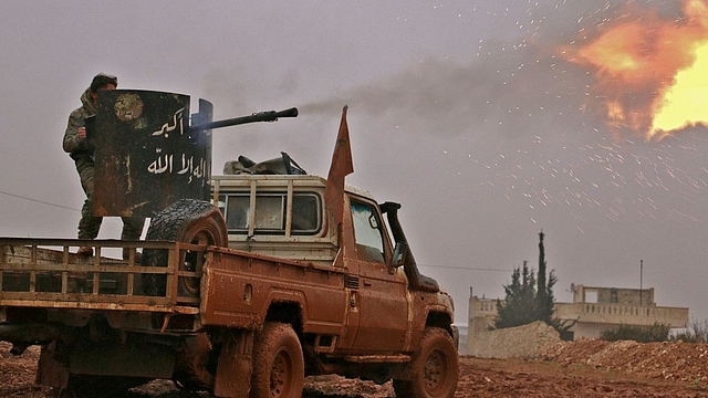 Syrian opposition fighters fire towards positions held by IS jihadists in Al Bab on the outskirts of Aleppo. (SALEH ABO GHALOUN/AFP/GettyImages)