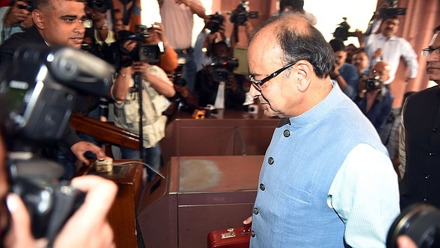 Finance Minister Arun Jaitley walks past media representatives prior to presenting the Union Budget at Parliament House in New Delhi. (PRAKASH SINGH/AFP/GettyImages)&nbsp;