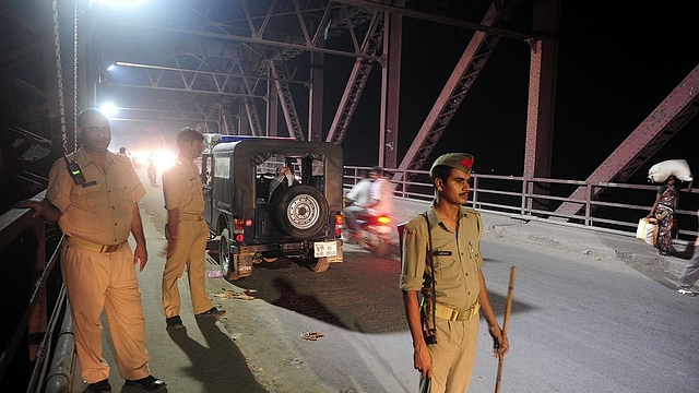 Indian policemen stand guard in the Ganga Raj ghat bridge  in Varanasi (SANJAY KANOJIA/AFP/Getty Images)