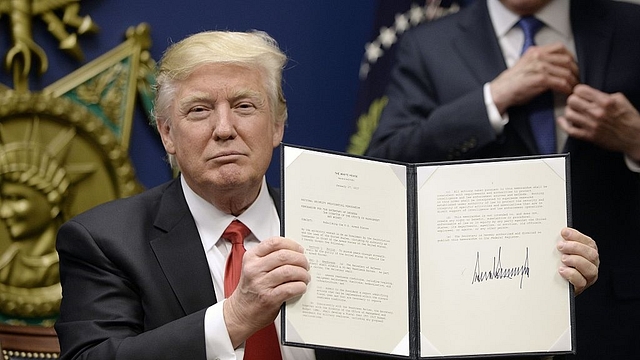 President Donald Trump signs an executive
order. (Olivier
Douliery-Pool/GettyImages)<em></em>