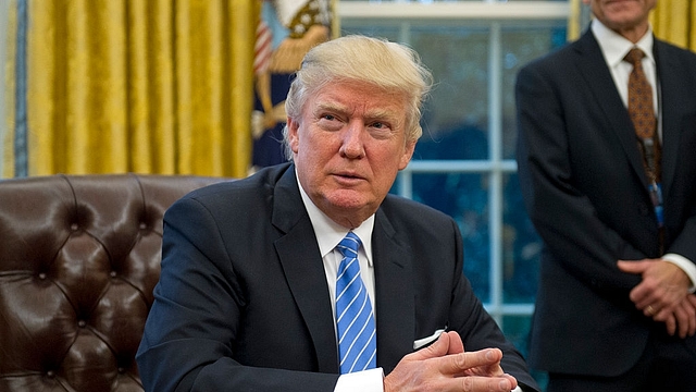 

U.S. President Donald Trump at his desk in the Oval office (Ron Sachs - Pool/Getty Images)