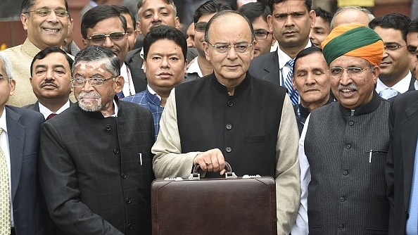 Finance Minister Arun Jaitley (centre) leaves his office to table the budget in Parliament in New Delhi on 1 February  2017. (DOMINIQUE FAGET/AFP/Getty Images)